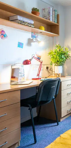 A desk in a student room in Deanery residence