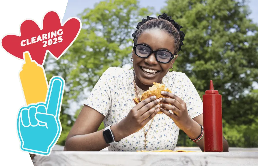 A young woman is eating a burger and smiling. There are stickers next to the image. Text says 'Clearing 2025'